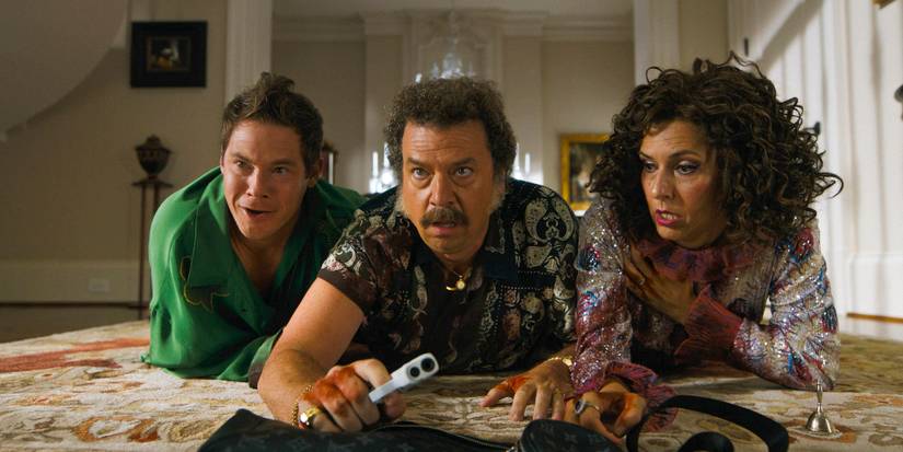 Kelvin (Adam Devine), Jesse (Danny McBride) and Judy (Edi Patterson) crawling on the floor with gunshot wounds in The Righteous Gemstones Season 4 Ep 9