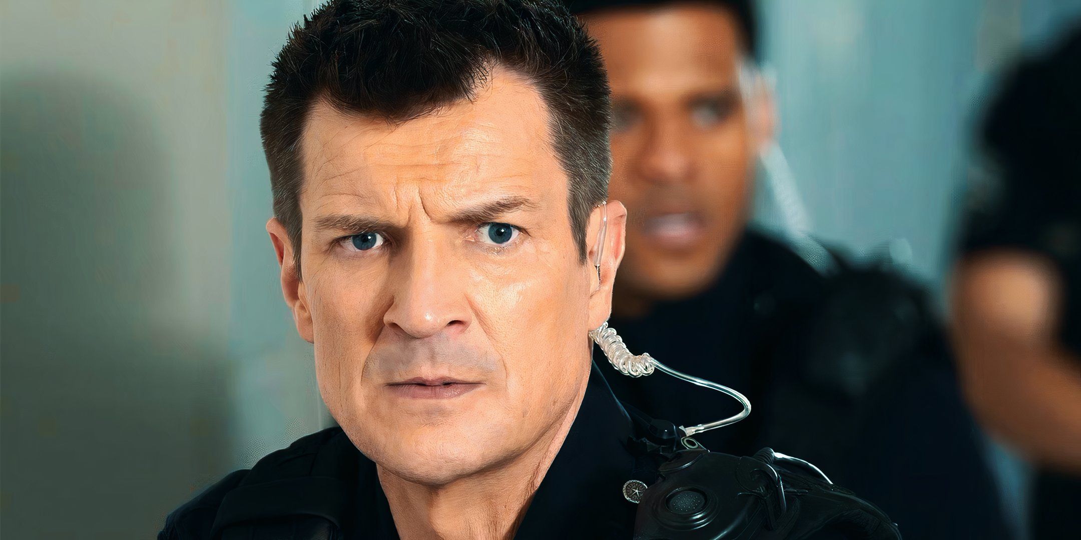 A closeup of Nathan Fillion as John Nolan from the Rookie season 7