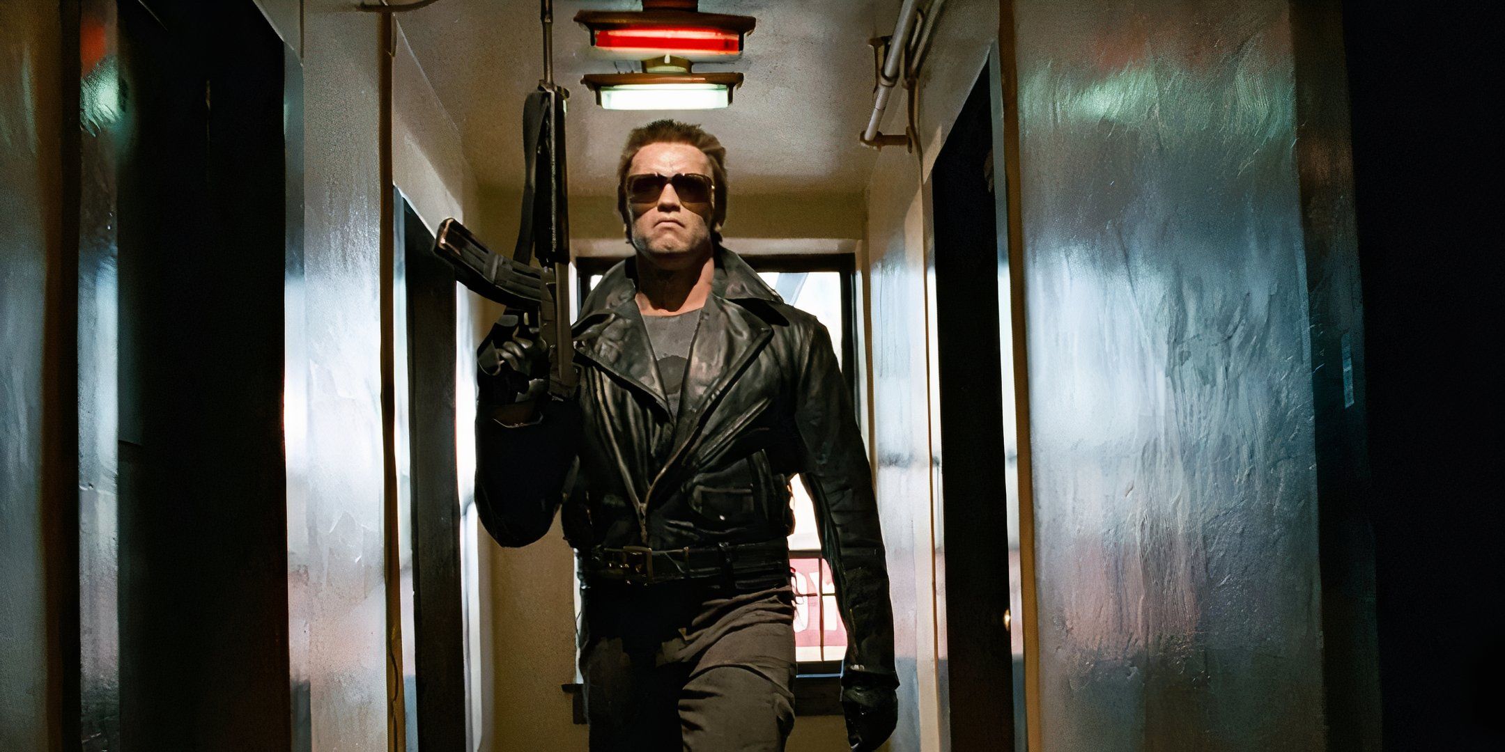 The Terminator walks down the police station hallways with a large gun in the first movie