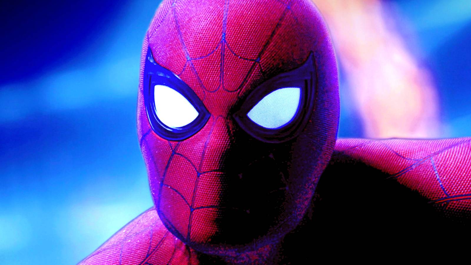 Tom Holland's Spider-Man looks at the camera in front of a bright blue background in Spider-Man No Way Home