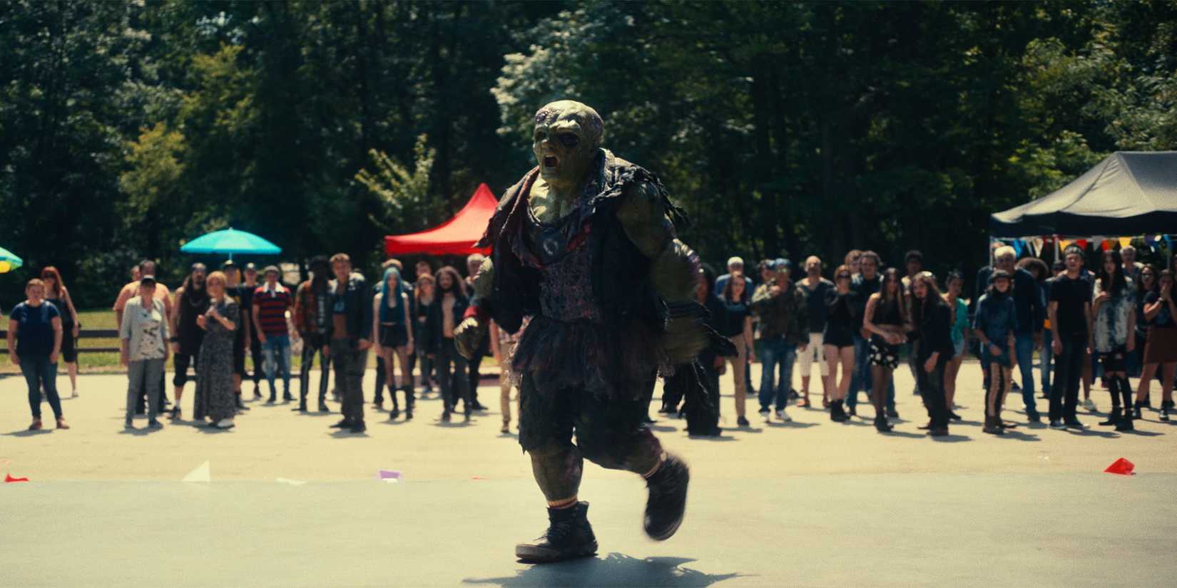 Toxie storming the concert in The Toxic Avenger