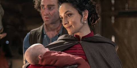 The Rani holding a baby in the Doctor Who season 15 episode 