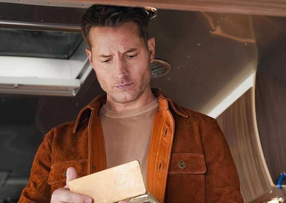 Colter looks pensively into a box in his Airstream