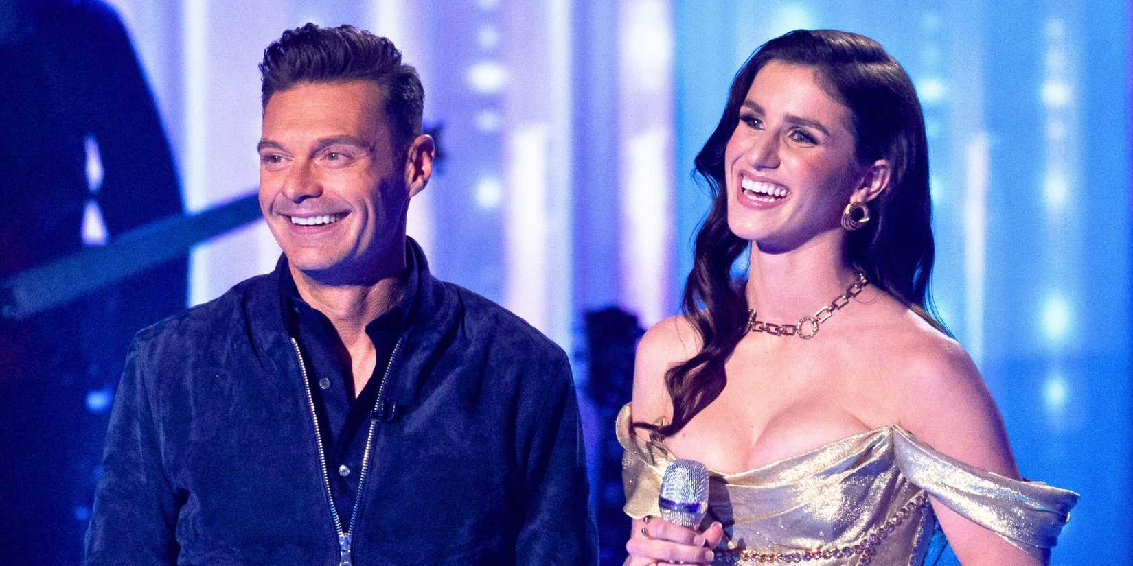American Idol Host Ryan Seacrest and Season 22 Winner Abi Carter Smiling Onstage