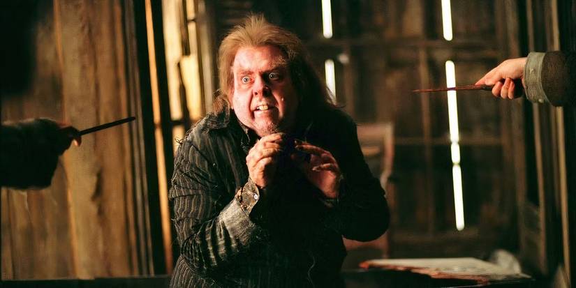 Wormtail looking alarmed while two wands are pointed at him in Harry Potter and the Prisoner of Azkaban