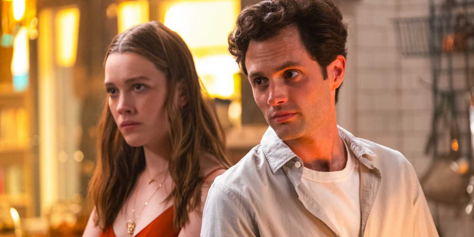 Love Quinn and Joe Goldberg look to the side in You