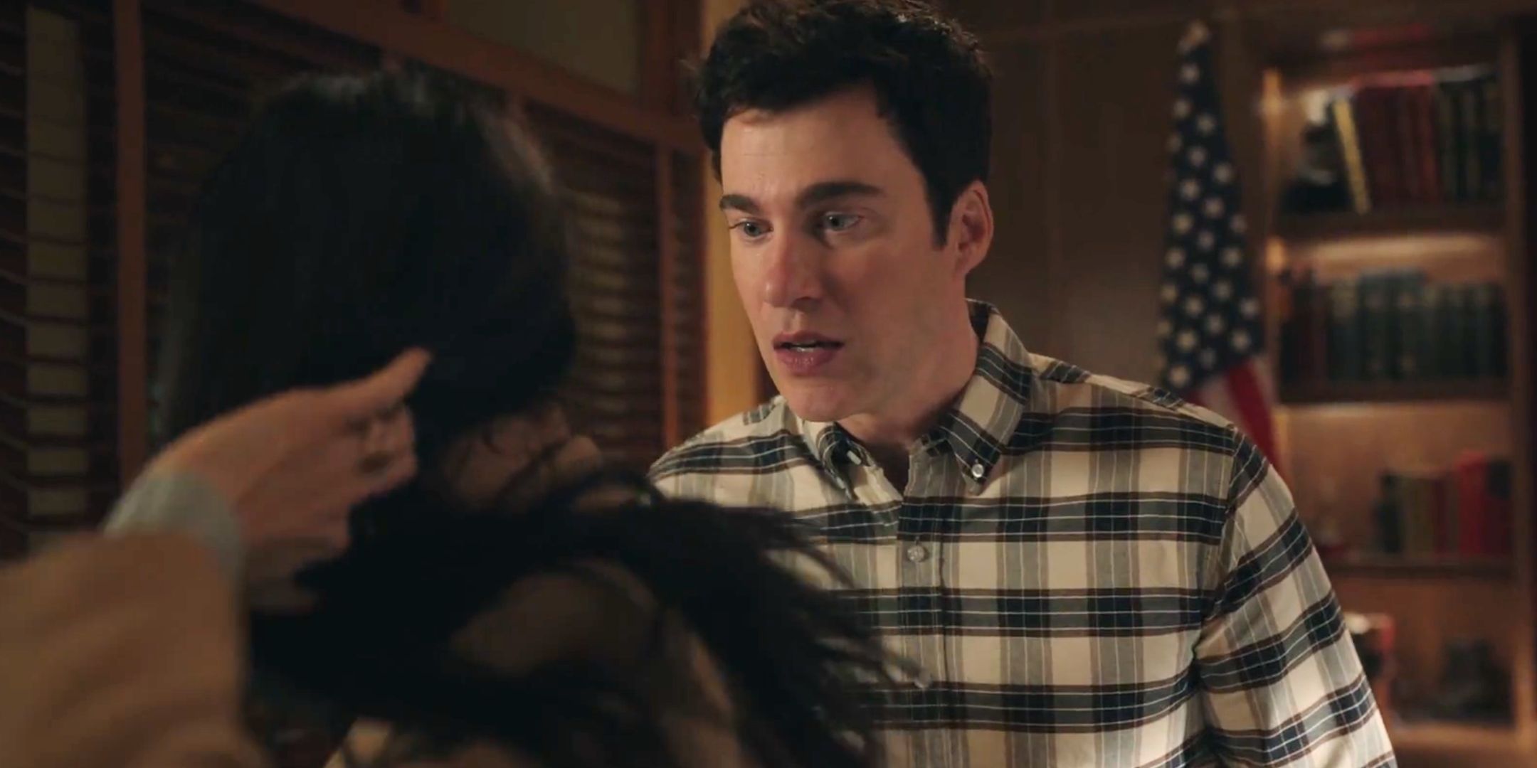 Ben looking at Kate's neck in Resident Alien