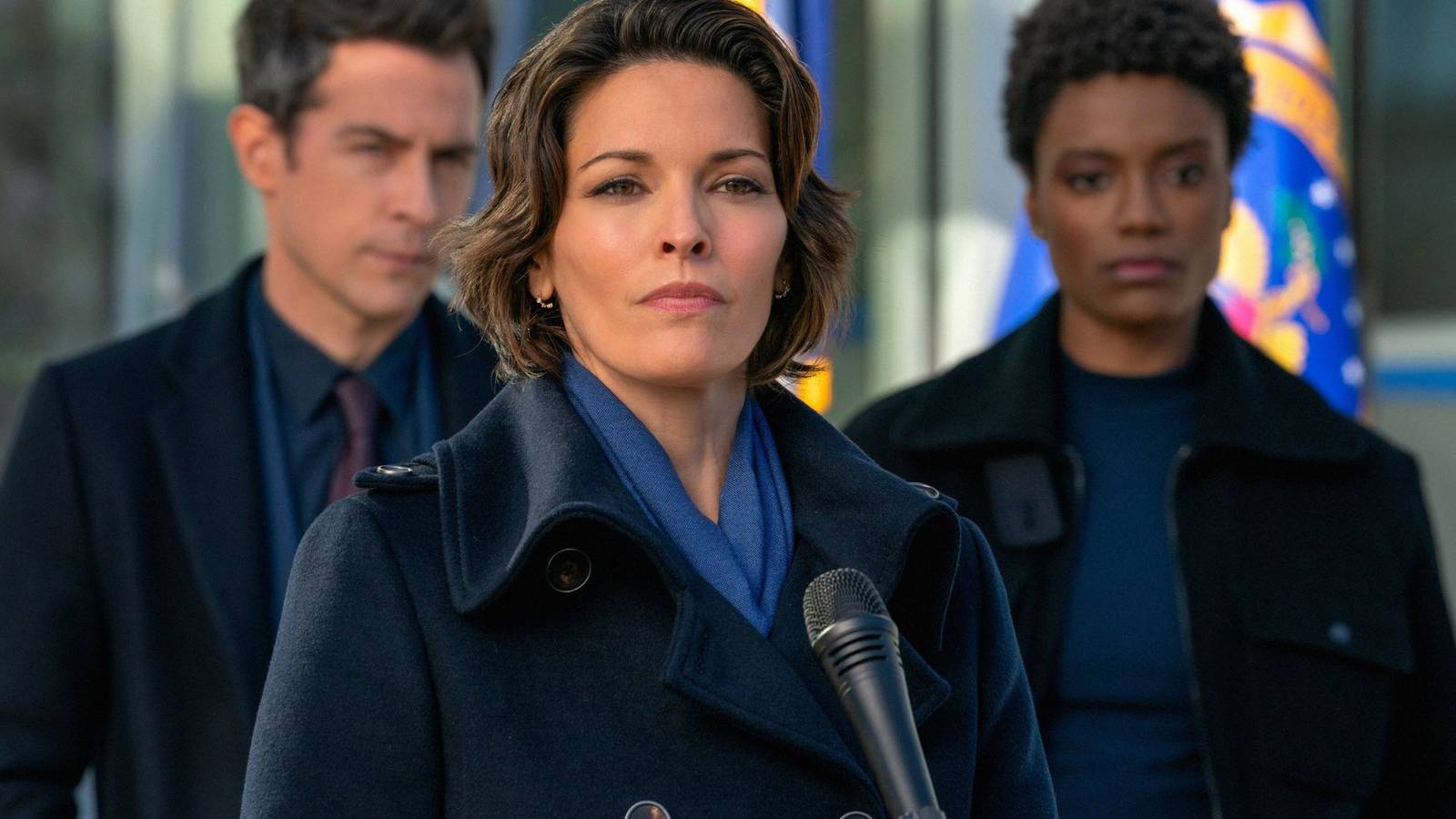 Isobel, Scola, and iffany standing ith eFBI office during a press conference