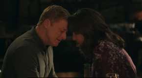 Harry and Heather with their heads together in Resident Alien