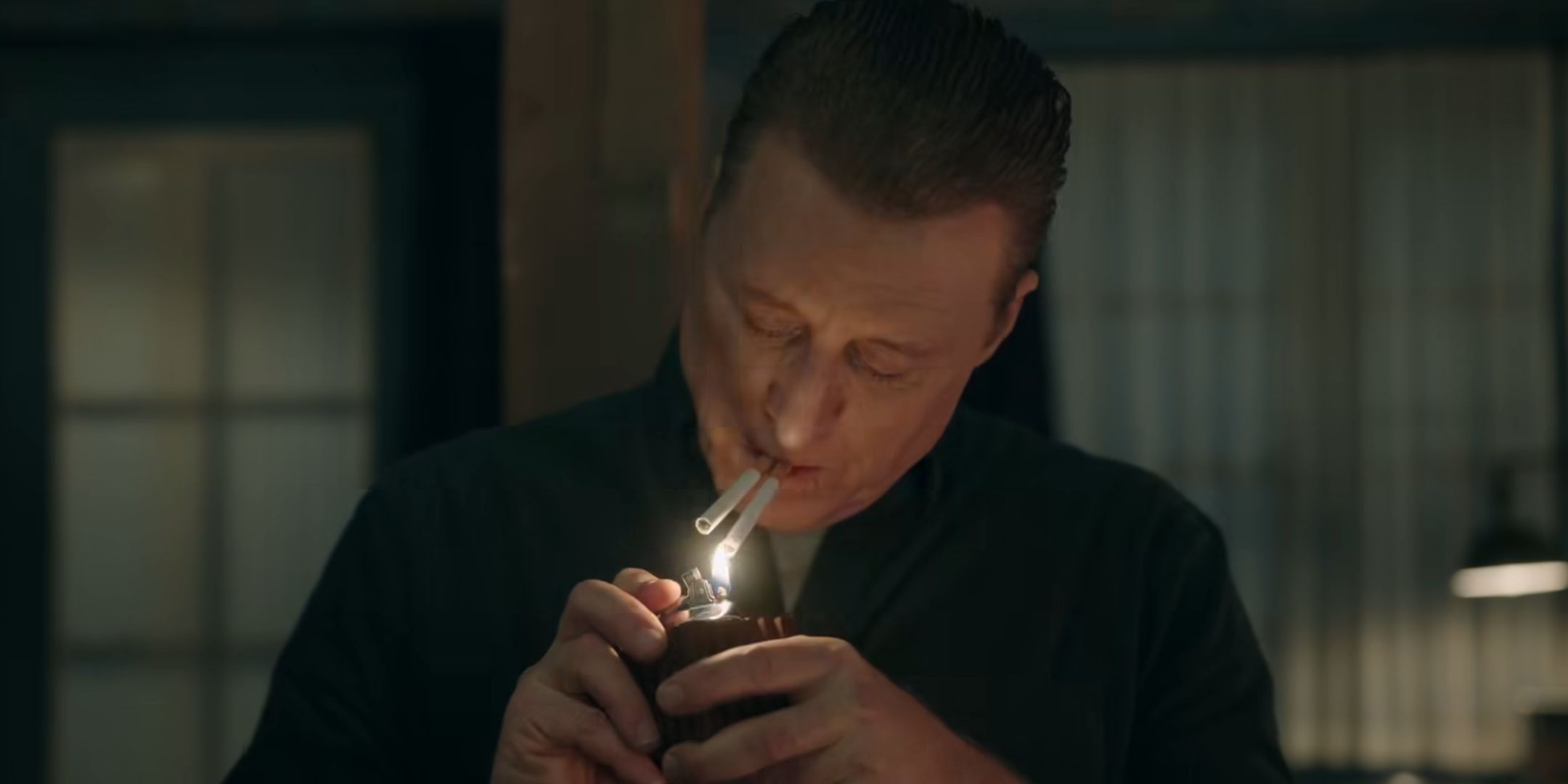 Alan Tudyk smoking two cigarettes at once as the Mantid in Resident Alien