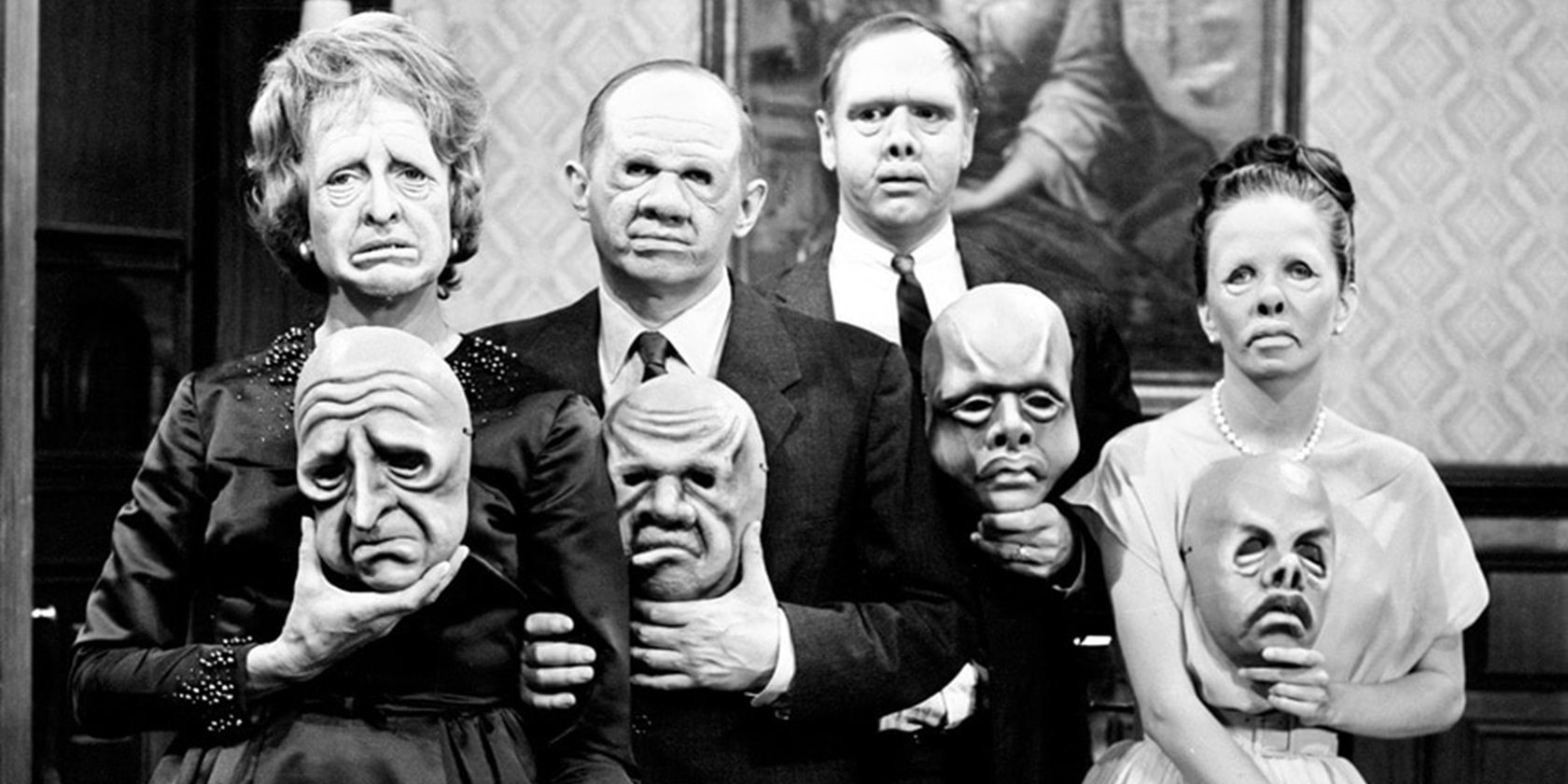 A family holding masks in The Twilight Zone