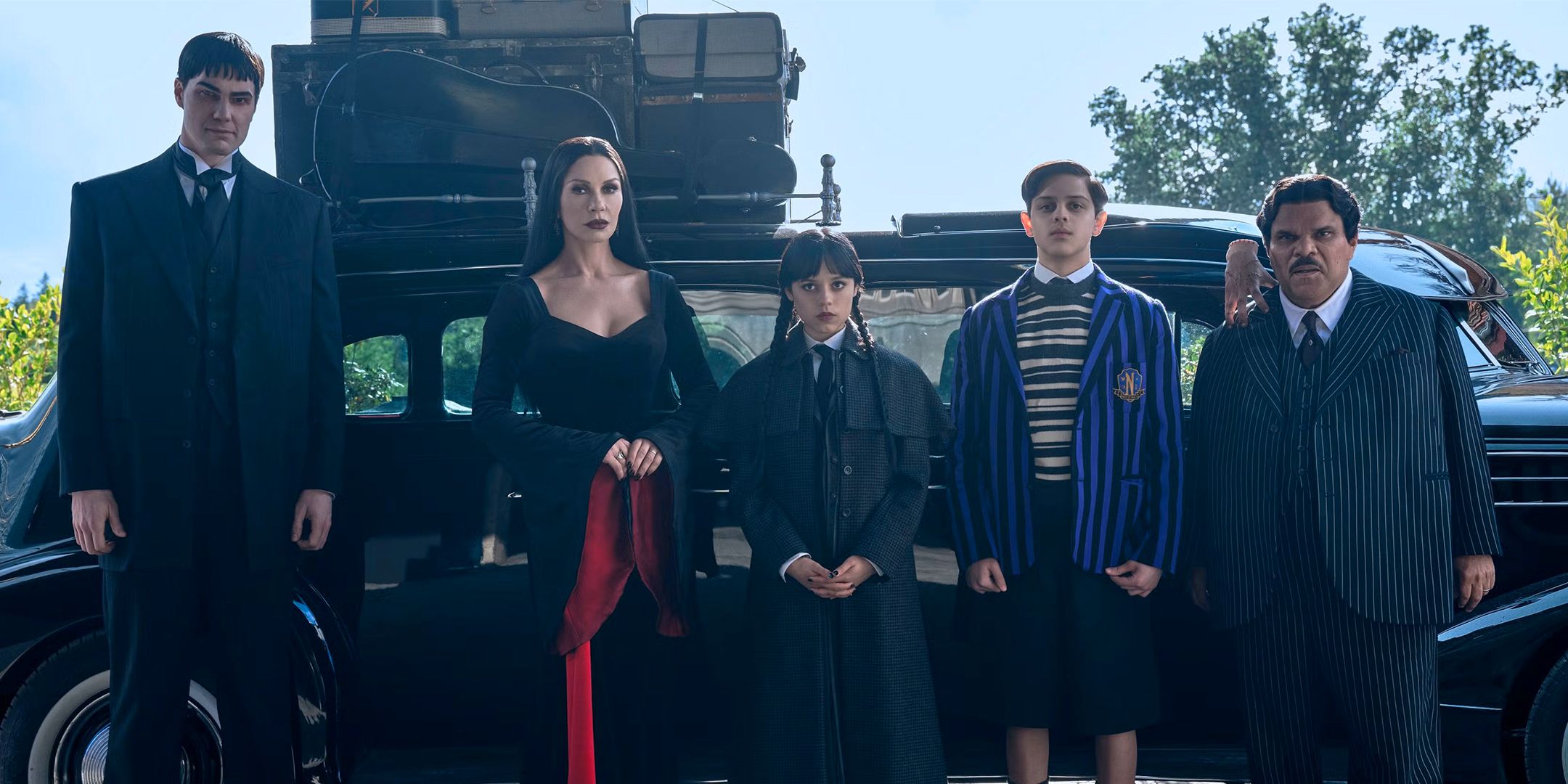 Cast of Wednesday Season 2 in Front of a Car