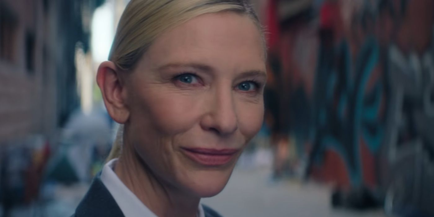 Cate Blanchett as the recruiter smiling in Squid Game season 3, episode 6