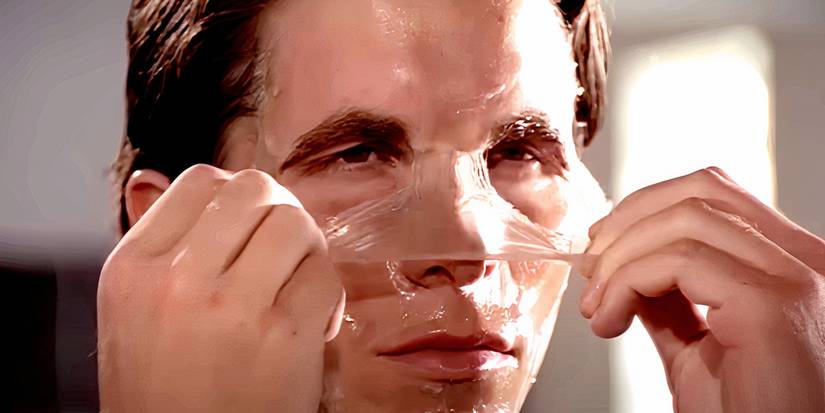 Christian Bale peeling a face mask in American Psycho