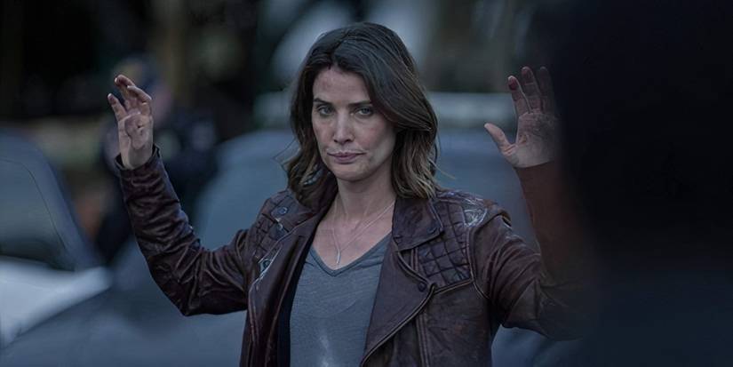 Cobie Smulders holding her hands up in Stumptown