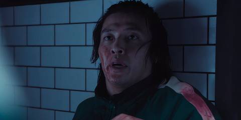 Dae-ho with his face covered in blood in Squid Game season 2