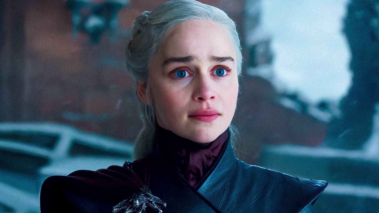 Emilia Clarke as Daenerys Targaryen looking surprised and sad in Game of Thrones