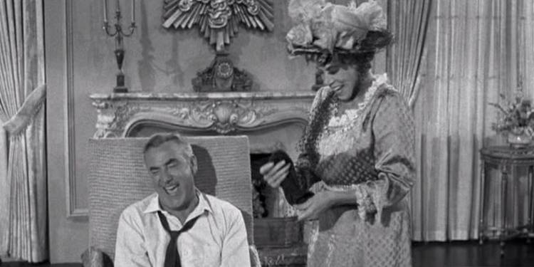 Drysdale (Raymond Bailey) and Pearl (Bea Benaderet) laughing together in The Beverly Hillbillies Jed Saves Drysdale's Marriage.