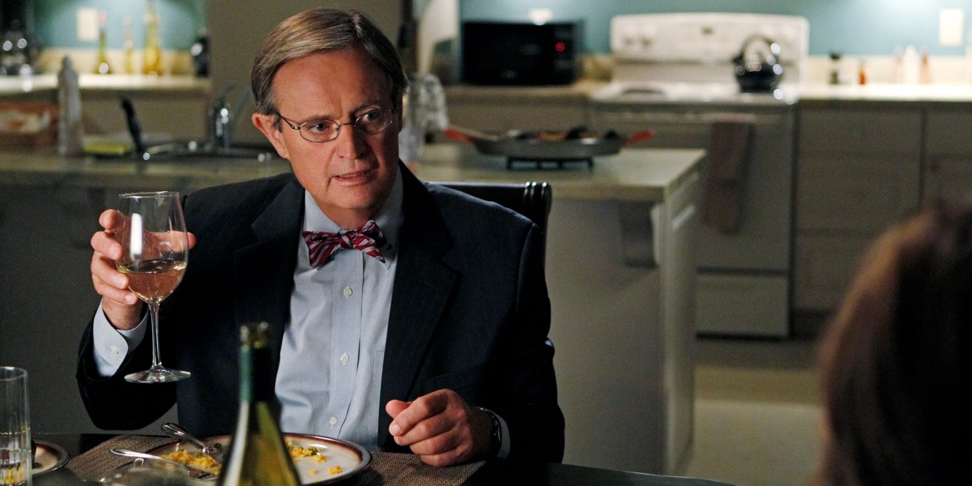 Ducky raising a glass of wine on a date in the NCIS episode Thirst