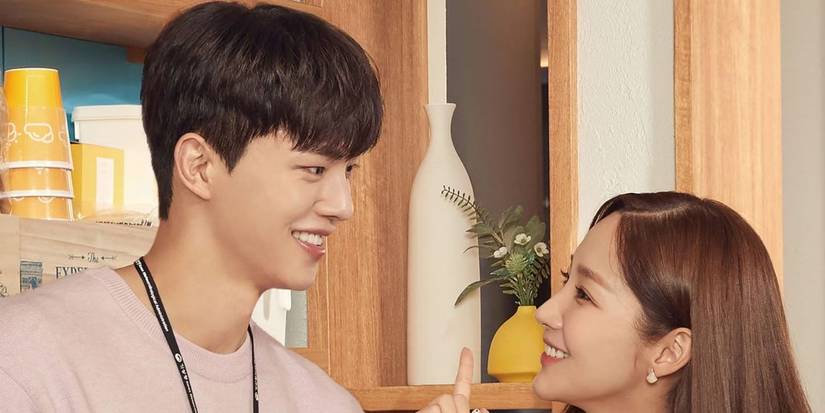 Song Kang and Park Min-young smiling at each other in Forecasting Love and Weather
