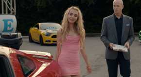 Young Georgia looking at a red car in Ginny & Georgia