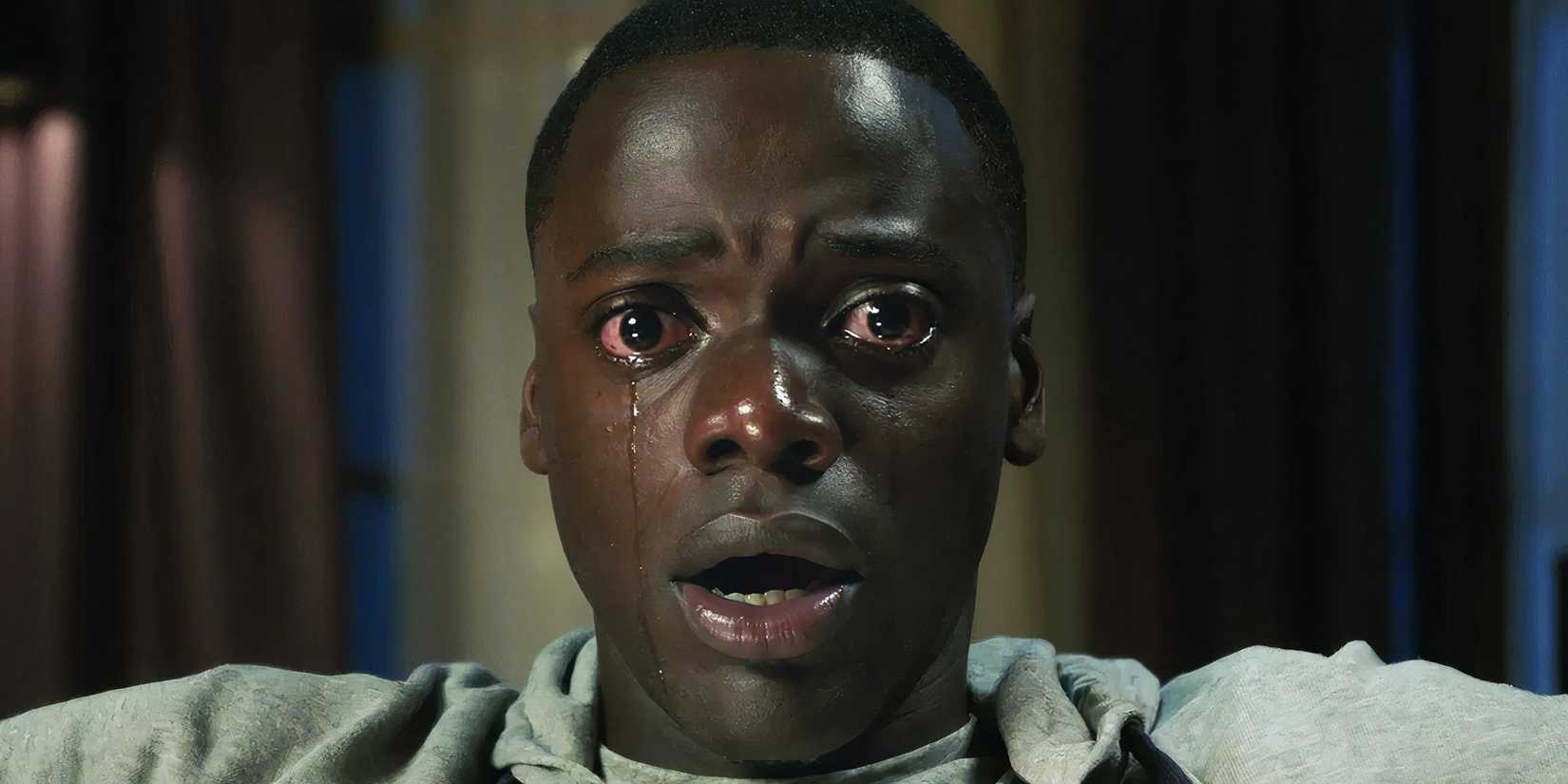 Daniel Kaluya looks directly into the camera while crying in Get Out