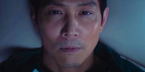 Gi-hun laying down looking solemn in Squid Game season 3 trailer