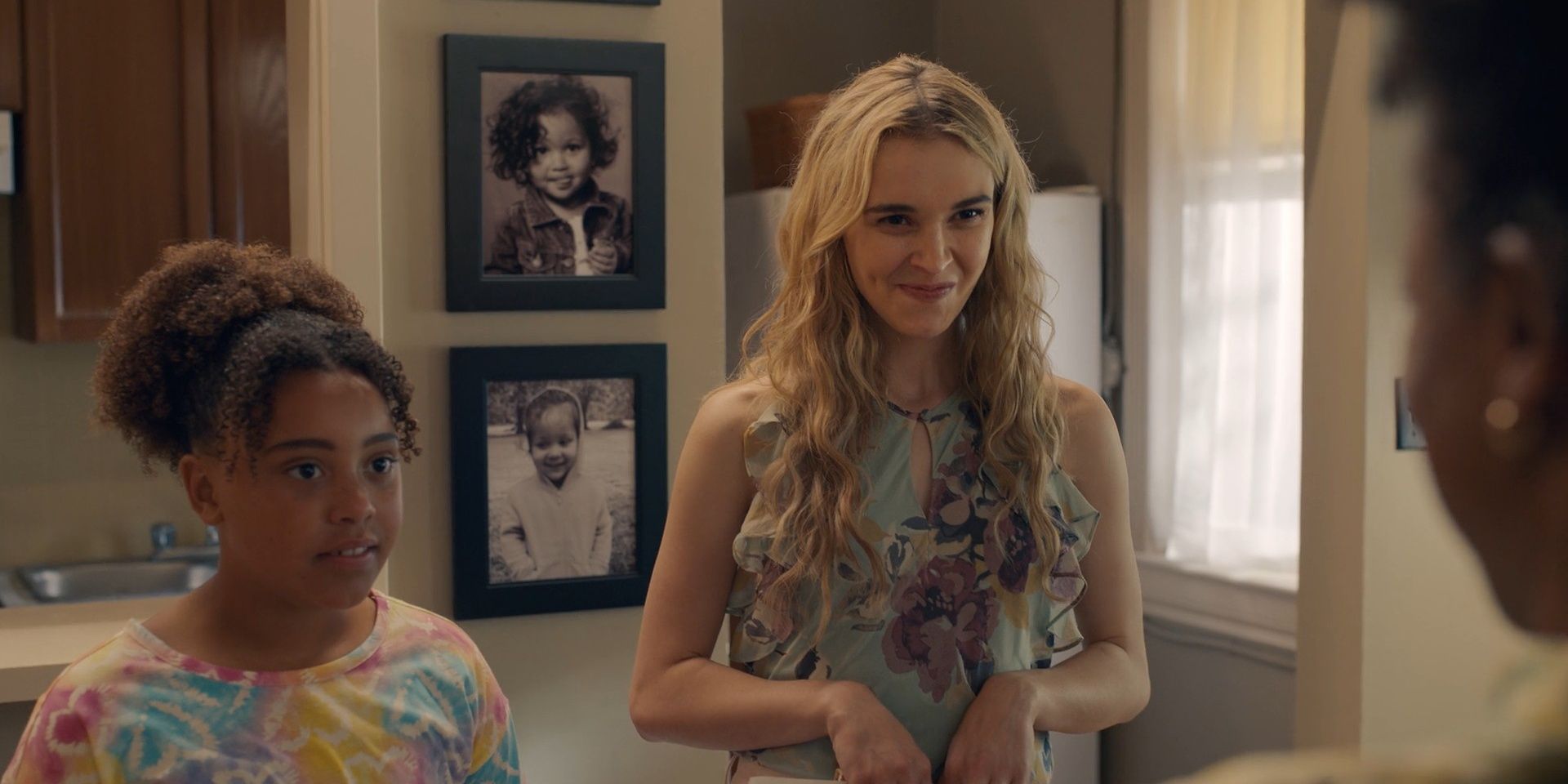 Young Georgia making a face at Lynette and standing next to young Ginny in Ginny & Georgia season 3 flashbacks