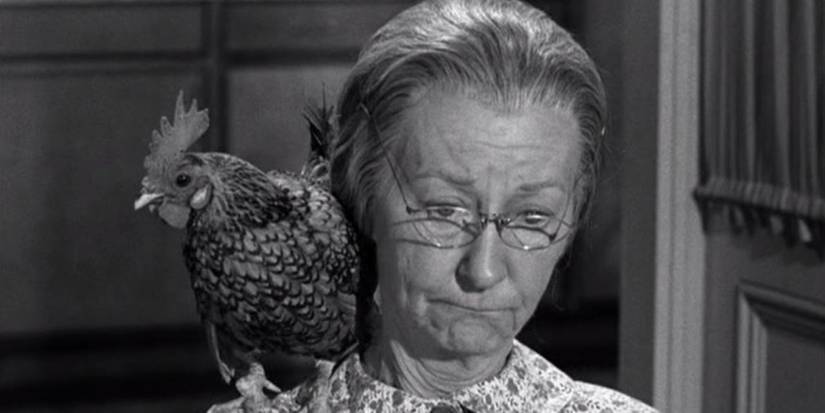 Granny (Irene Ryan) looking annoyed with a chicken on her shoulder in The Beverly Hillbillies The Clampetts Entertain.