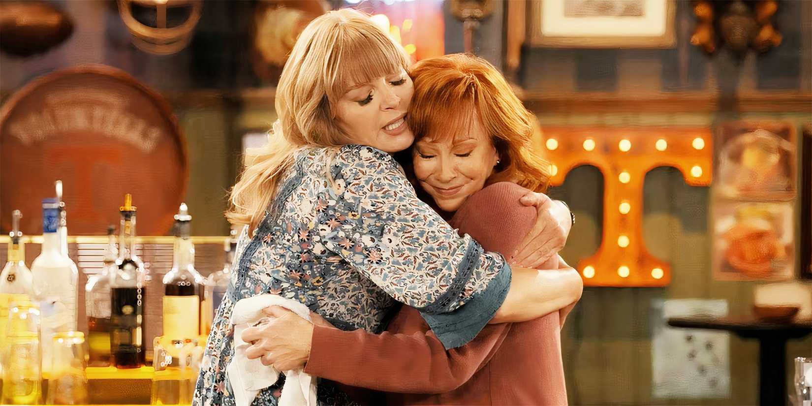 image of Happy's Place Season 2 Reba as Bobbie and Melissa Peterman as Gabby hugging
