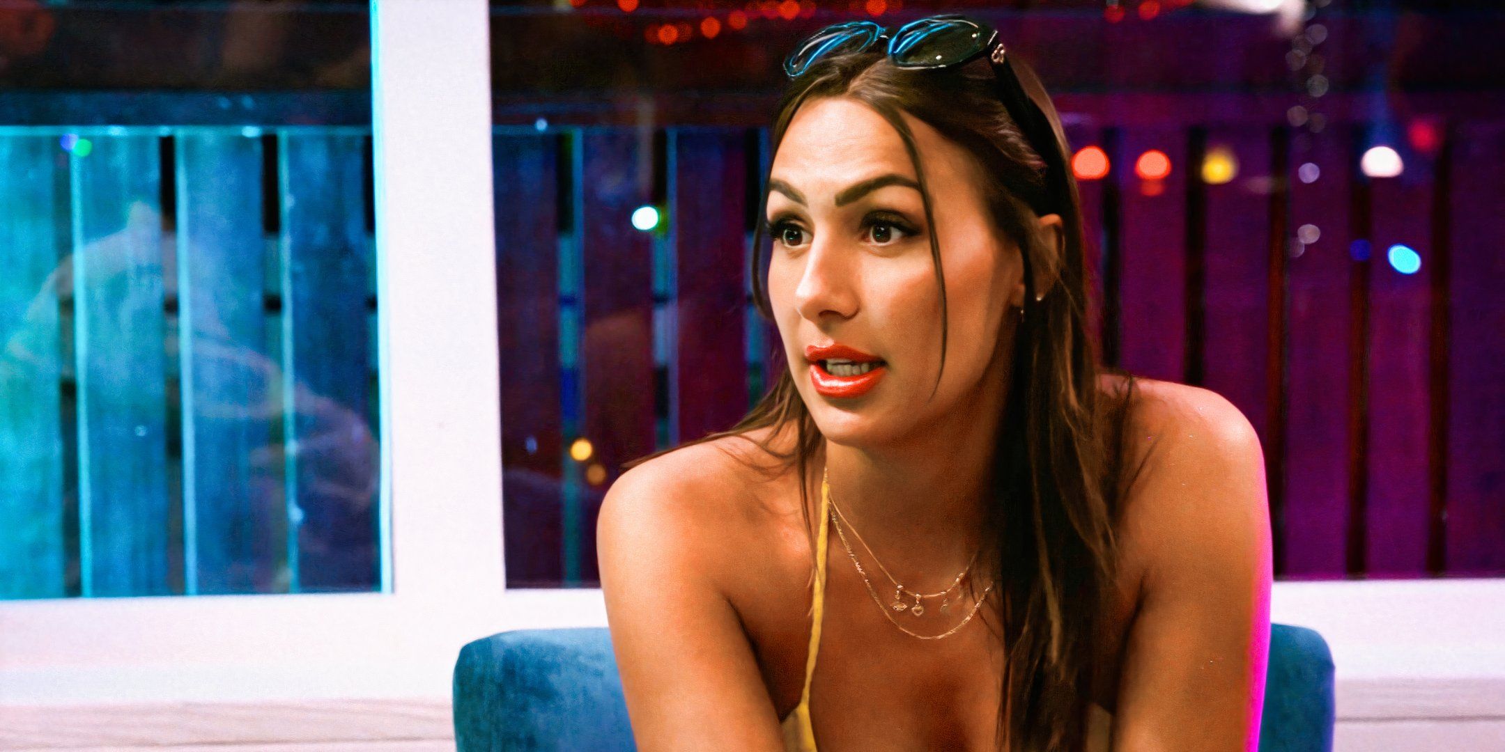 Below Deck's Solène Favreau in a yellow spaghetti strapped top 