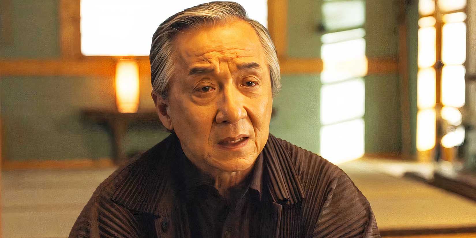 Jackie Chan looking disappointed as Mr. Han in Karate Kid: Legends