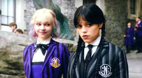 Jenna Ortega as Wednesday Addams looking at the camera and Emma Myers as Enid Sinclair looking at Wednesday in Wednesday season 2 teaser video