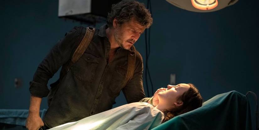 Joel looking down at Ellie in the operating room in The Last of Us