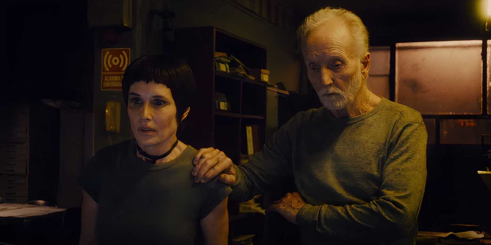 John Kramer with his hand on Amanda Young's shoulder in Saw X