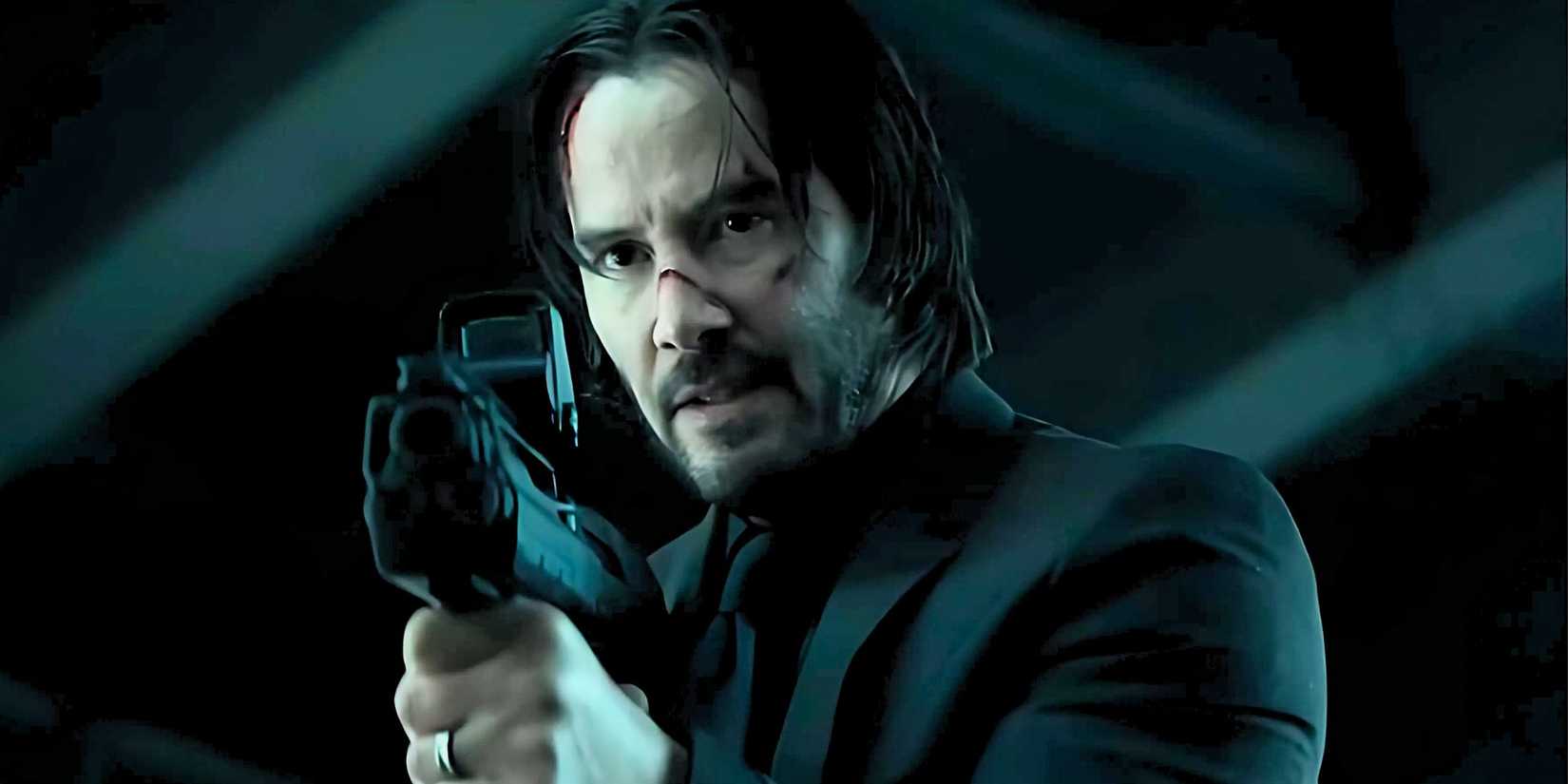 Keanu Reeves as John Wick holding a big gun