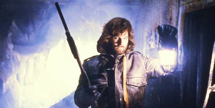 Kurt Russell holding a sH๏τgun as MacReady in The Thing