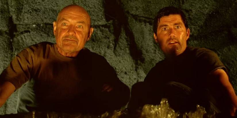 Locke (Terry O'Quinn) and Jack (Matthew Fox) looking at something in Lost.