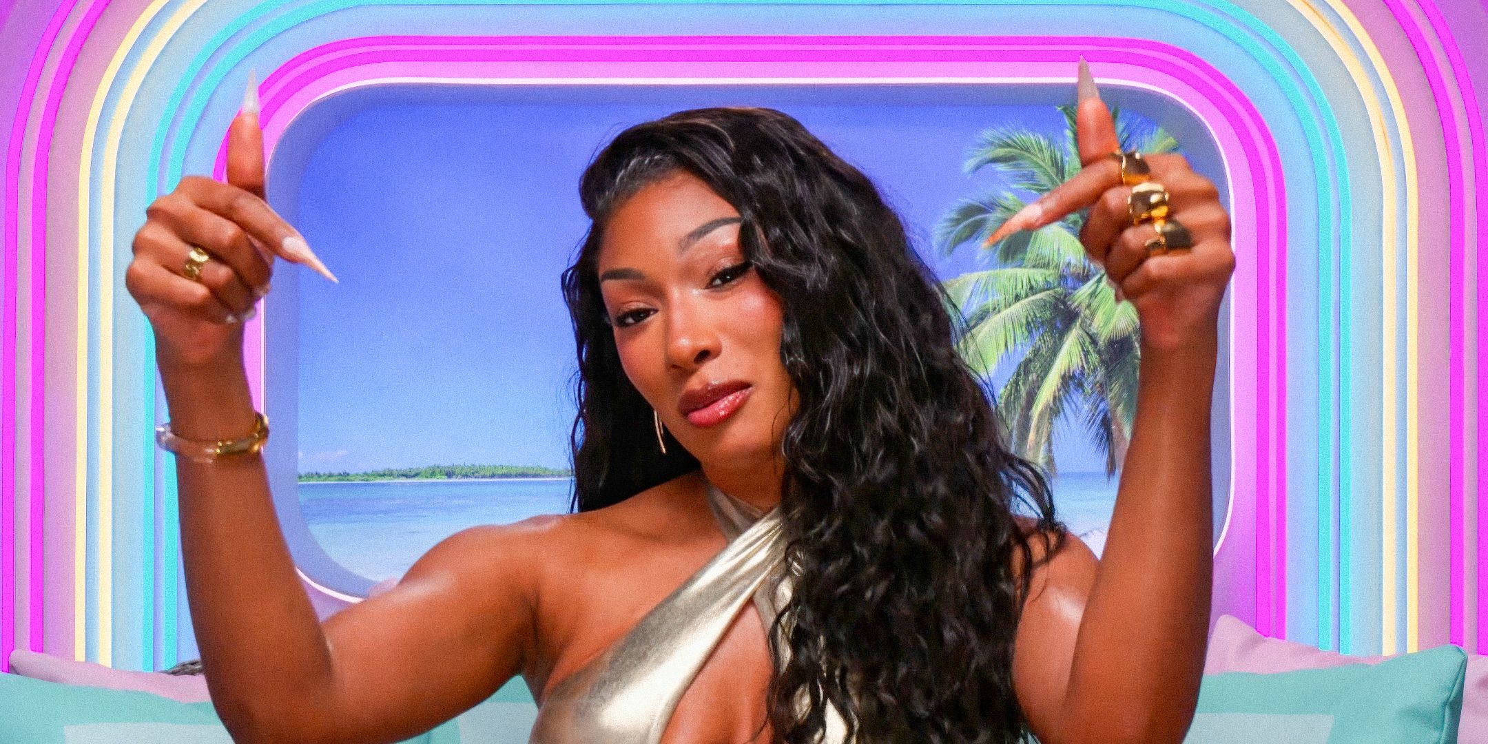 Love Island USA Megan Thee Stallion making a hand sign during an interview