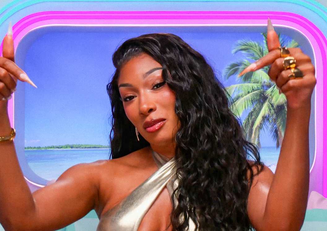 Love Island USA Megan Thee Stallion making a hand sign during an interview