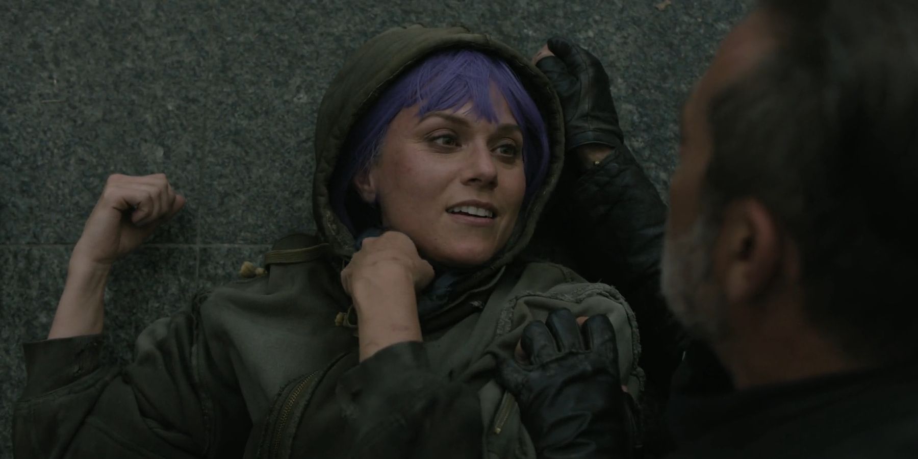 Lucille (Hilarie Burton) lying on the ground looking up at Negan in The Walking Dead: Dead City season 2