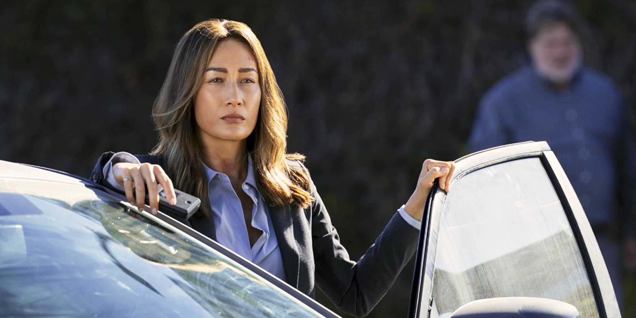 Maggie Q as Ballard in the Bosch Spinoff Standing Next to an Open Car Door