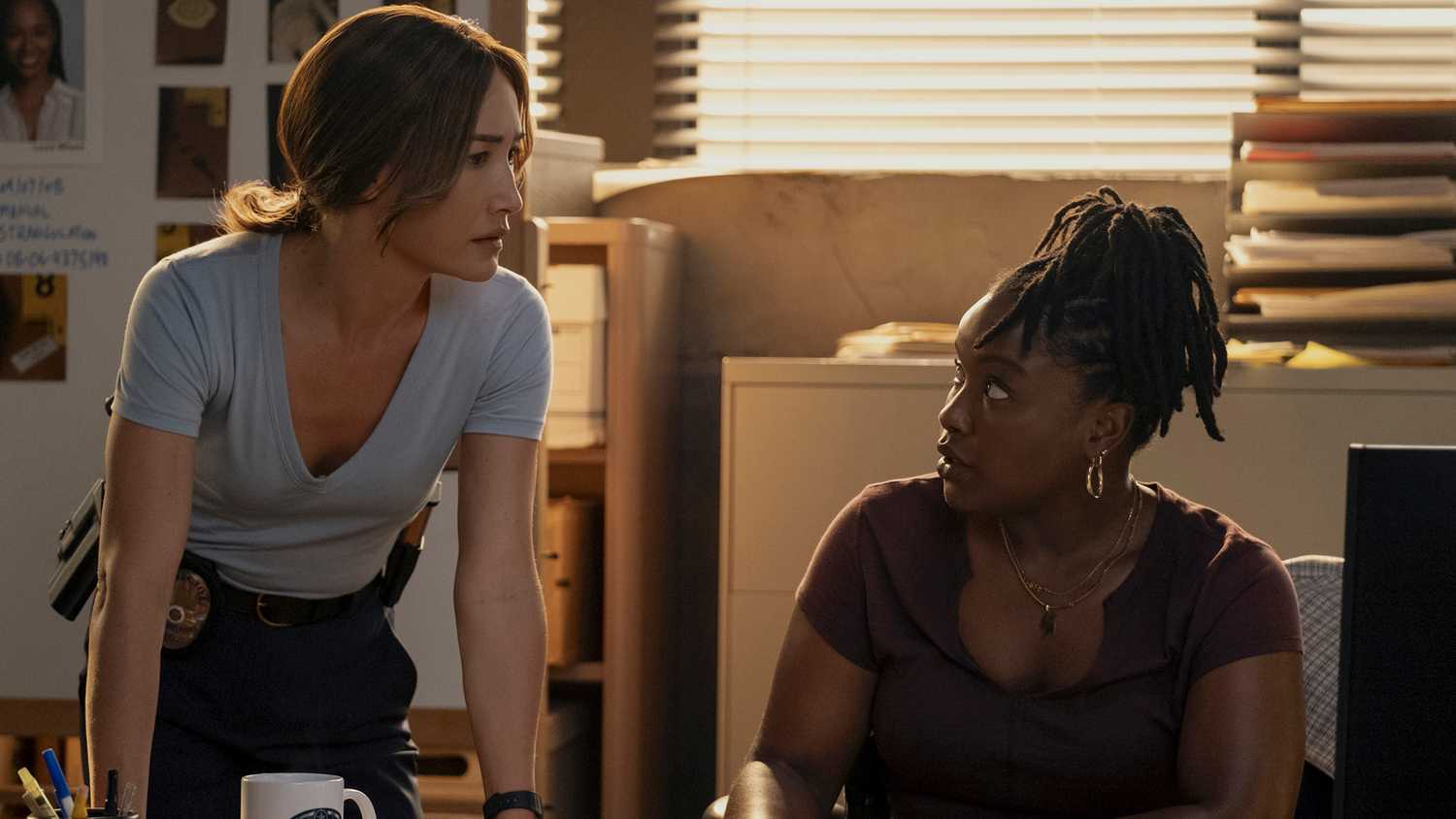 Maggie Q's Renée looking in thought and Courtney Taylor's Samira looking intrigued in Ballard