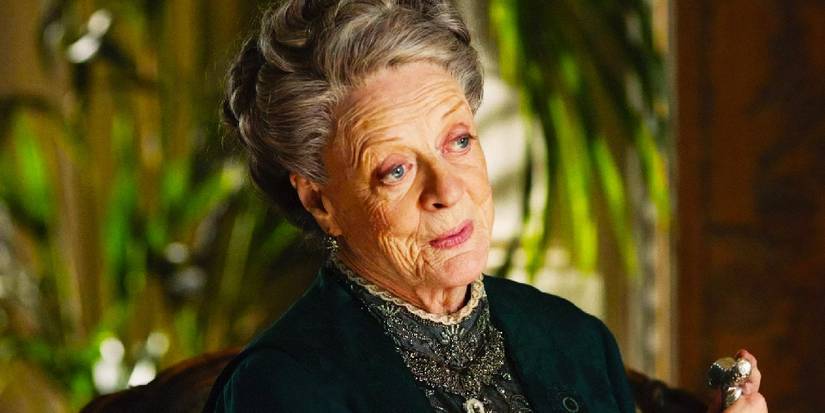 Maggie Smith smiling in Downton Abbey.