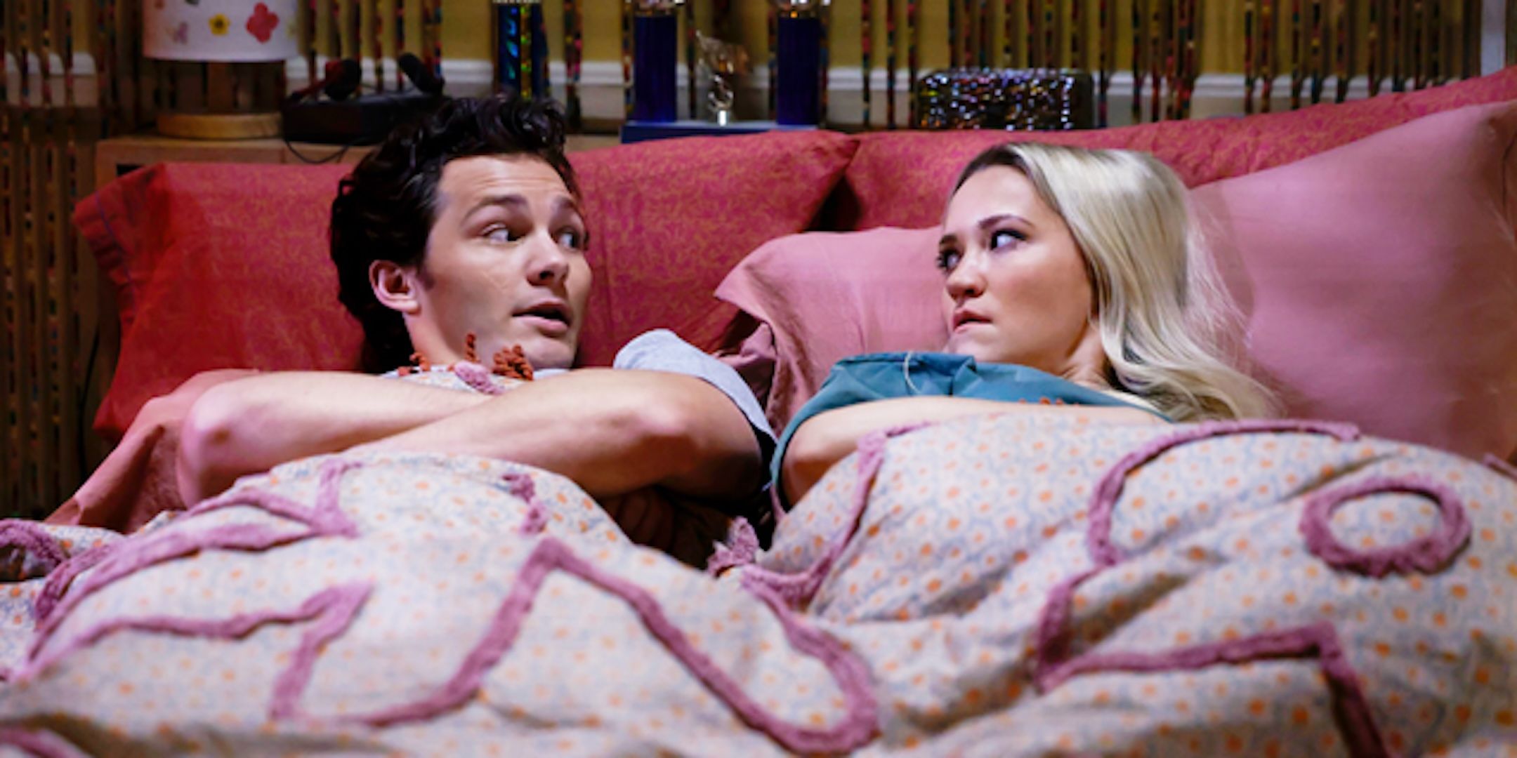 Montana Jordan's Georgie and Emily Osment's Mandy lie in bed fighting in Georgie & Mandy's First Marriage