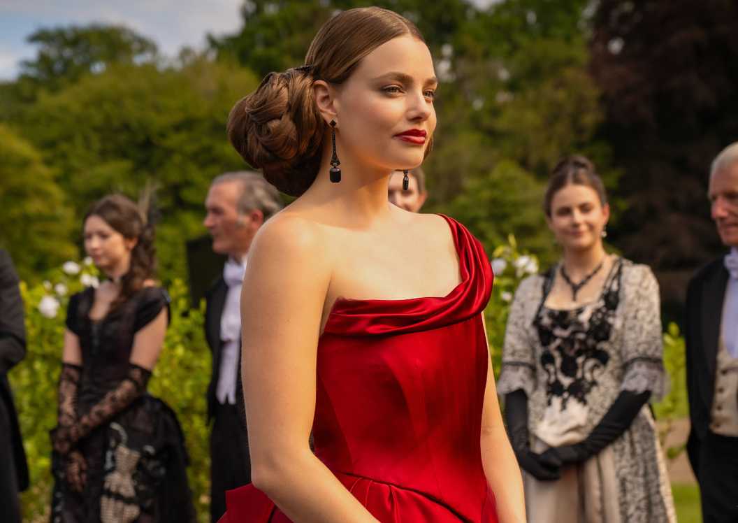 nan red dress buccaneers Theatrical updos, exquisite tiaras and scarlet lip smearssee the most dramatic hair and make-up looks in The Buccaneers Season 2