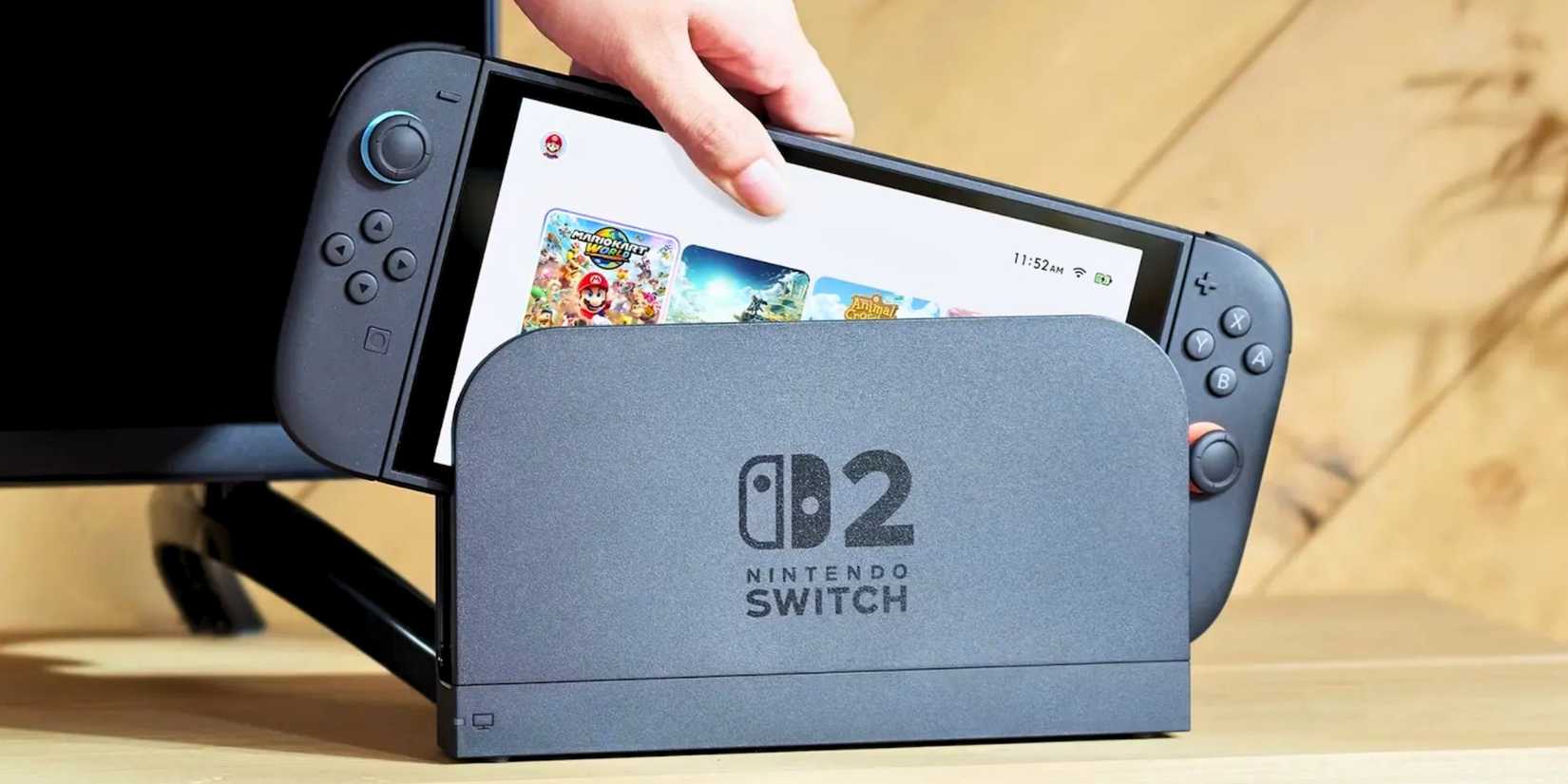 Nintendo Switch 2 being loaded into a dock with the home screen visible as it's being placed inside the dock by a person's hand.