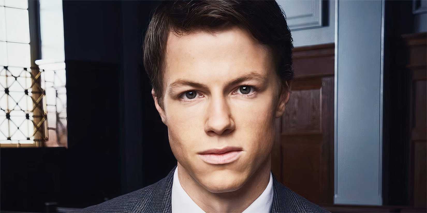 Milo Callaghan as Rudy Baylor in The Rainmaker tv series close up looking confident