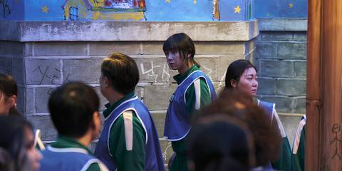 Park Song Hoon's Hyun-ju looking back at other players before the hide and seek game in Squid Game season 3