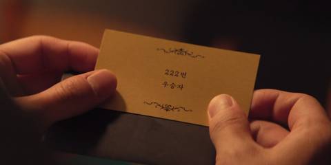 Player 222's winner card in Squid Game season 3, episode 6